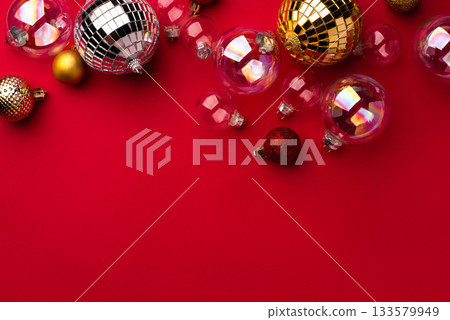 Festive Christmas ornaments on a red background. Festive Christmas ornaments on a red background. 133579949