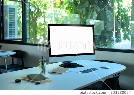 Display computer and office tools on desk. computer screen clipping path cluttered office desk 133580034