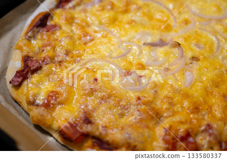 Homemade Baked Pizza with Sausage, Cheese, and Onion on Baking Tray Homemade Baked Pizza with Sausage, Cheese, and Onion on Baking Tray 133580337