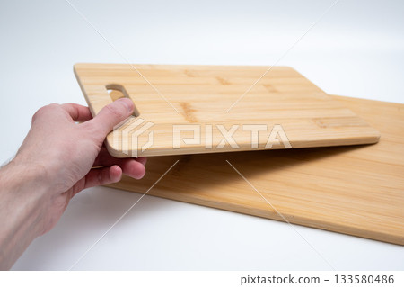 Two Bamboo Cutting Boards with Handles on White Two Bamboo Cutting Boards with Handles on White 133580486