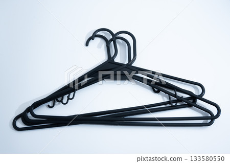 Black Plastic Clothes Hanger on White Background 133580550
