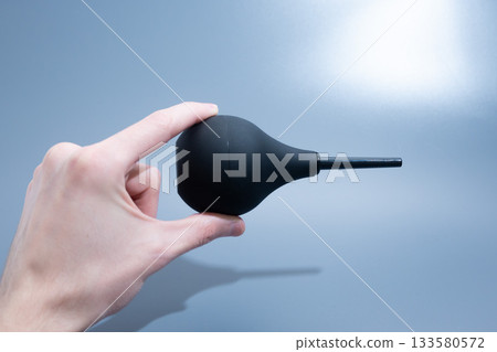Black Rubber Enema Bulb on gray Background Black Rubber Enema Bulb on gray Background 133580572