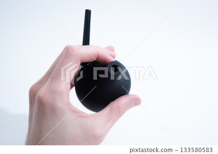 Black Rubber Enema Bulb on White Background 133580583