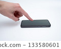 Modern smartphone in human hand on white background for technology advertisement 133580601