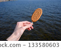 Delicious Chocolate Nut Ice Cream by Lake in Summer 133580603
