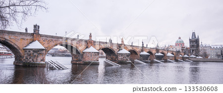 Historical Charles Bridge, Czech: Karluv most, over Vltava River in winter. Prague, Czech Republic. 133580608