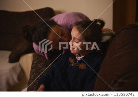 Mother And Daughter Share A Tender Moment At Home In A Cozy Living Room Mother And Daughter Share A Tender Moment At Home In A Cozy Living Room 133580742