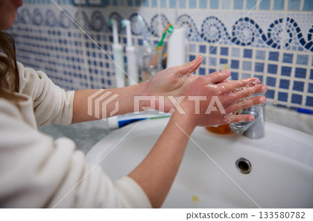 Child Washing Hands At Sink In Bathroom For Hygiene And Health Care Safety Practice Child Washing Hands At Sink In Bathroom For Hygiene And Health Care Safety Practice 133580782
