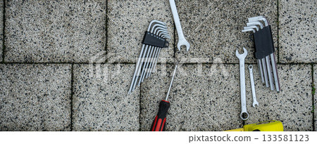 Various repair tools. Must-have for men. Equipment for building. Repair tool kit. Grey background top view pattern copy space 133581123