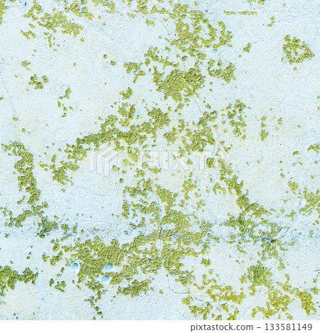 Peeling painted concrete wall, cracks of green blue and beige, peeling paint of the old rough concrete wall, peeling paint texture 133581149