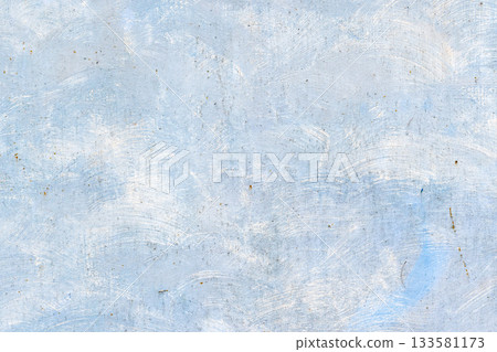 An old metal wall painted in white over pale blue backdrop 133581173