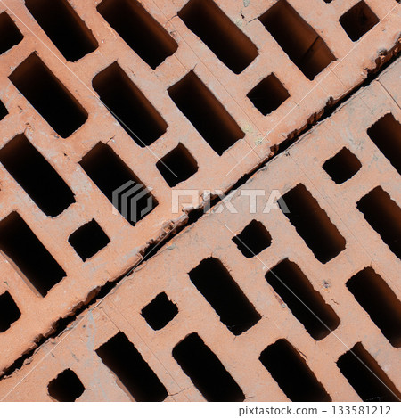 Clay red brick close-uo macro texture. Construction brick isolate on white 133581212