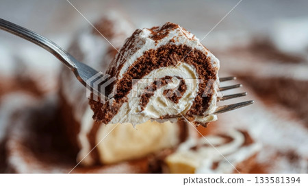 Macro photo of a fork lifting a slice of buche de noel, showcasing creamy swirls and rich chocolate textures, perfect for holiday dessert inspiration 133581394