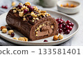 Vegan buche de noel topped with nuts and dried fruit, elegantly presented on a minimal plate with soft shadows and modern styling for holiday celebrations 133581401