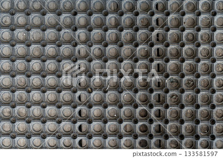 Holes rubber door mat for wiping foot with round holes texture asbtraction 133581597