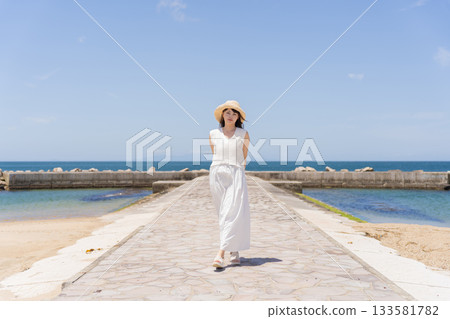 A woman relaxing on the coast 133581782