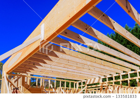 Wooden rafters are being installed for new home under residential area. 133581833