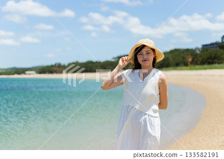 woman relaxing on the beach woman relaxing on the beach 133582191
