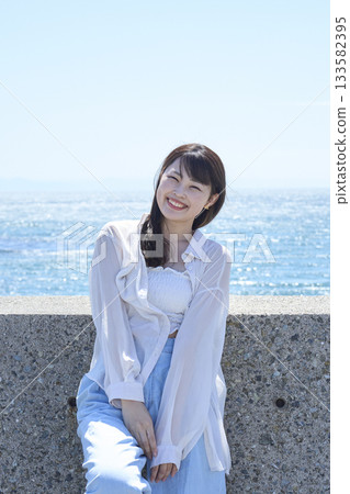 A woman relaxing on the coast 133582395