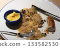 Sausage With Sauerkraut and Mustard on White Plate 133582530