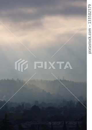 The sky is cloudy and the sun is shining through the clouds 133582579