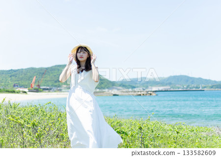 A woman relaxing on the coast 133582609