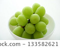 Fresh Shine Muscat grapes served in a white bowl 133582621