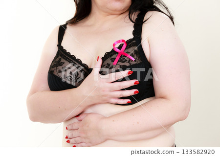 Woman chest in bra, pink cancer ribbon 133582920