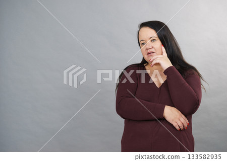 Thinking adult woman 133582935