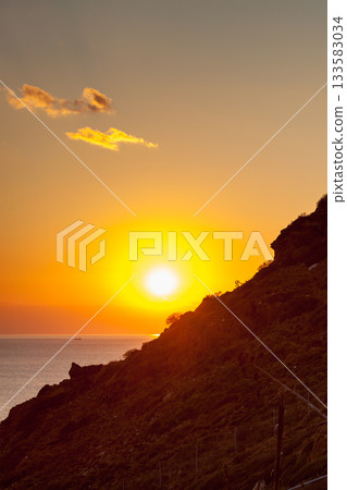 Sunrise or sunset over sea surface 133583034