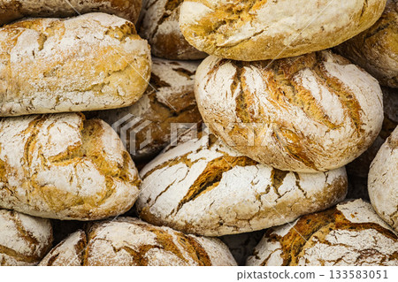 Many rustic fresh bread loaves Many rustic fresh bread loaves 133583051