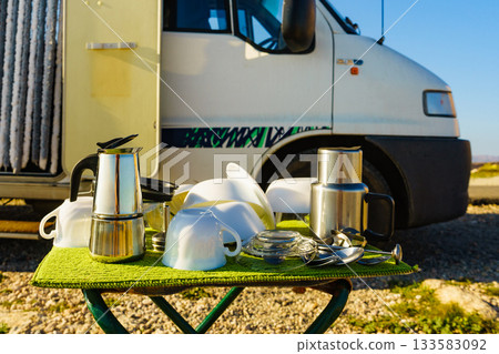 Clean dishes drying on fresh air, capming outdoor Clean dishes drying on fresh air, capming outdoor 133583092