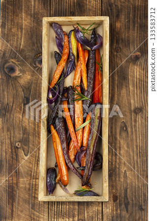 Vegetarian healthy food, baked carrots. 133583712