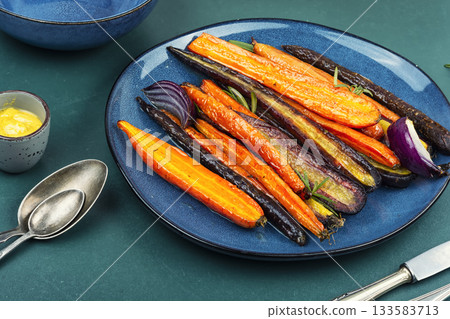 Baked baby carrots. 133583713