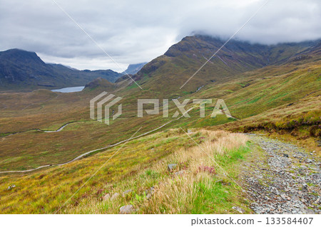 Hiking trail through Cuillin mountains on Isle of Skye Scotland UK Hiking trail through Cuillin mountains on Isle of Skye Scotland UK 133584407