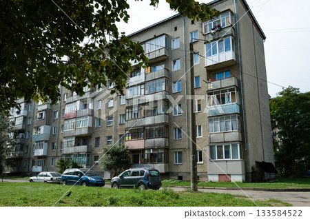 Modern urban living in a quaint neighborhood featuring classic architecture and lush greenery on a sunny day 133584522