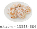 Romantic biscuit. Round gingerbread cookies in plate on a white background. Spicy sweets for holiday. Top view. 133584684