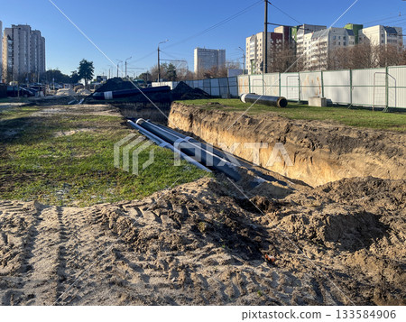 Urban heating pipeline construction trench in residential district Urban heating pipeline construction trench in residential district 133584906