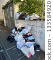 Discarded clothes, bedding and paper waste at Japanese garbage collection point in Japan 133584920