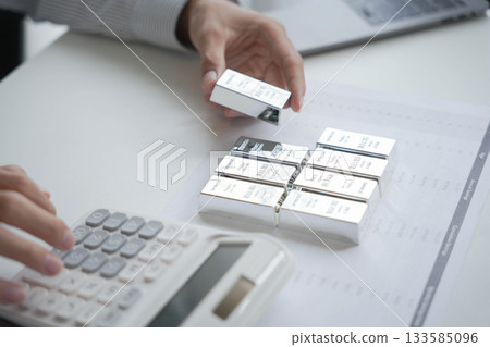 Silver Trading Businessman invest in trading silver, calculating profit price of selling silver. Silver Trading Businessman invest in trading silver, calculating profit price of selling silver. 133585096