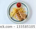 Aerial view of a hot sandwich and french fries 133585105