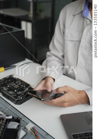Closeup hand of computer hardware technician dissemble and  fixing computer PC. 133585140