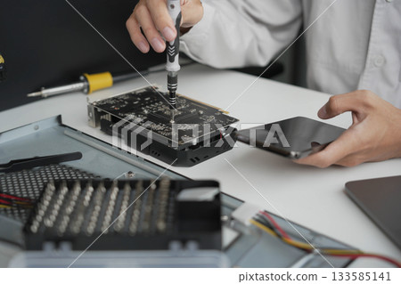 Closeup hand of computer hardware technician dissemble and  fixing computer PC. 133585141