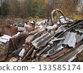 rustic scrap debris, rural scene featuring mosscovered broken roofing sheets and salvage prospects, closeup view of aged corrugated roof pieces and timber with moss and decay in rustic 133585174
