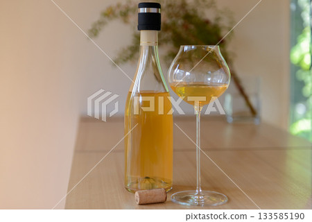 Natural orange wine and wine glasses Natural orange wine and wine glasses 133585190