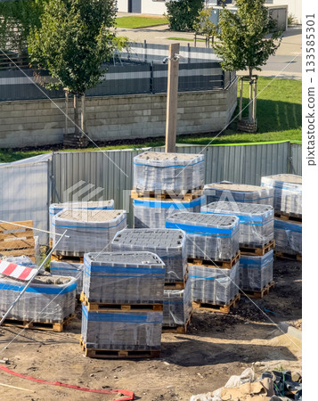 Pavement Concrete Tiles at Pallet Construction Site. Urban construction, paving slabs Pavement Concrete Tiles at Pallet Construction Site. Urban construction, paving slabs 133585301