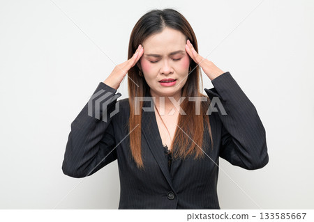 Stressed Asian Business Woman Having Headache Studio Portrait on White Background Stressed Asian Business Woman Having Headache Studio Portrait on White Background 133585667