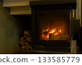 burning wood in the fireplace. the cozy atmosphere of a country house.  133585779