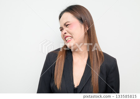 Disgusted Asian Business Woman Studio Portrait on White Background Disgusted Asian Business Woman Studio Portrait on White Background 133585815