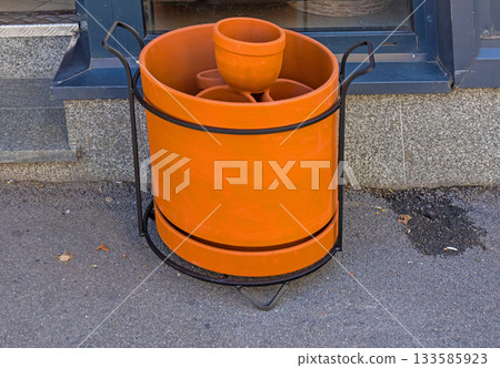 Orange terracotta clay bowls 133585923
